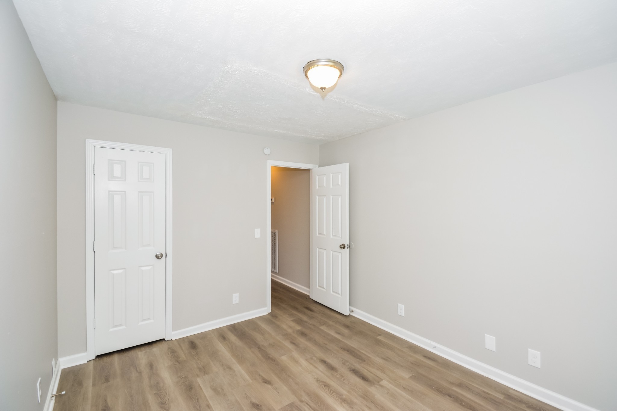 2607 Landrum Court, Unit 8 Springfield, TN 37172 - Photo 13 of 17 a view of an empty room with wooden floor
