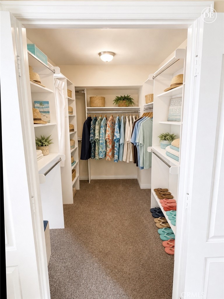11582 Foster Road Los Alamitos, CA 90720 - Photo 15 of 26 Walk in Closet
Note: Furniture in this photo has been digitally enhanced by AI