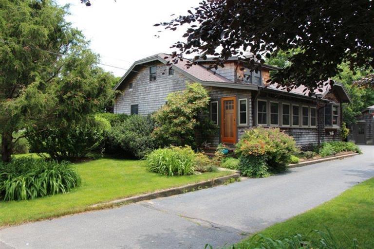 137 Jefferson Road Bourne, MA 02532 - Photo 1 of 28 a front view of a house with a yard and potted plants