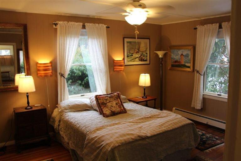 137 Jefferson Road Bourne, MA 02532 - Photo 15 of 28 a bedroom with a bed and a lamp