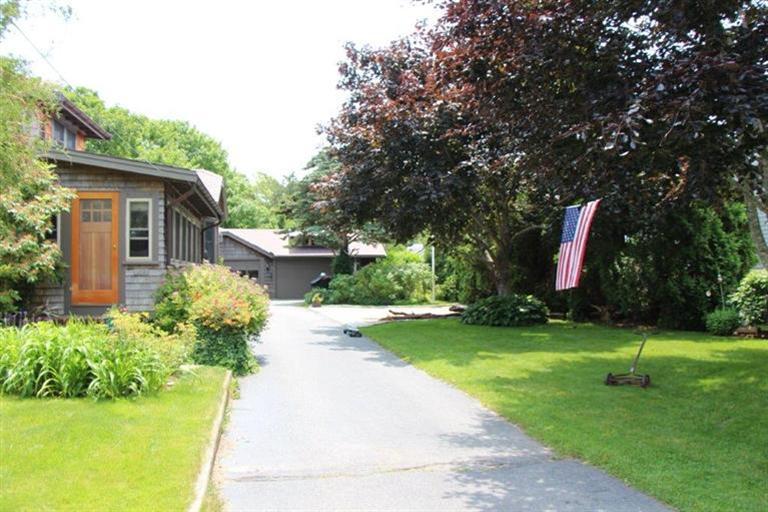 137 Jefferson Road Bourne, MA 02532 - Photo 18 of 28 a front view of a house with swimming pool and garden