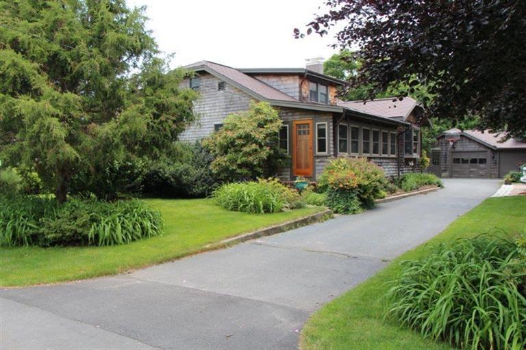 137 Jefferson Road Bourne, MA 02532 - Photo 2 of 28 a front view of a house with a garden