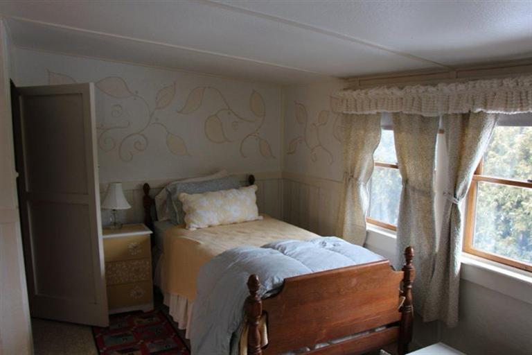 137 Jefferson Road Bourne, MA 02532 - Photo 22 of 28 a bed sitting in a bedroom next to a window