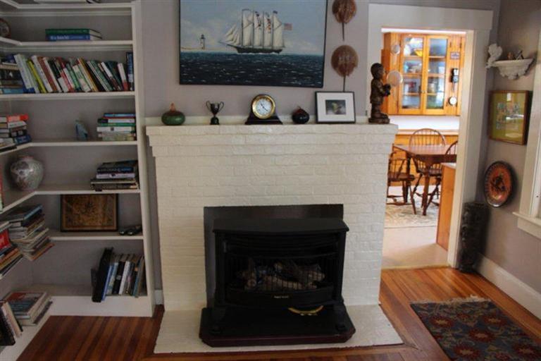 137 Jefferson Road Bourne, MA 02532 - Photo 25 of 28 a living room with furniture and a fireplace