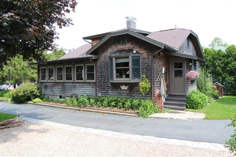 137 Jefferson Road Bourne, MA 02532 - Photo 3 of 28 a front view of a house with a yard