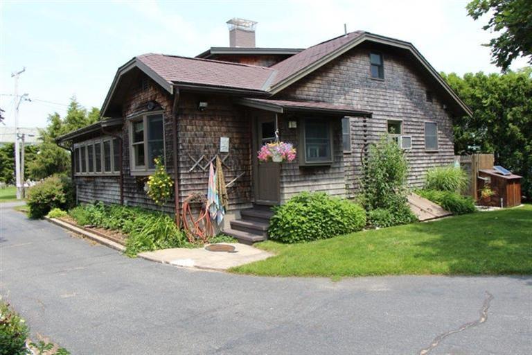 137 Jefferson Road Bourne, MA 02532 - Photo 4 of 28 a front view of a house with garden