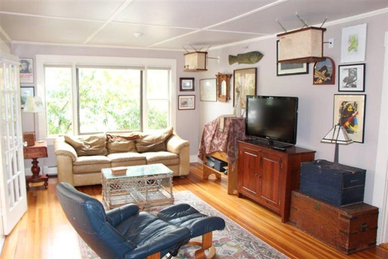 137 Jefferson Road Bourne, MA 02532 - Photo 10 of 28 a living room with furniture and a flat screen tv