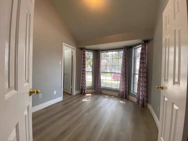1512 Lorson Loop Round Rock, TX 78665 - Photo 9 of 29 an empty room with wooden floor and windows