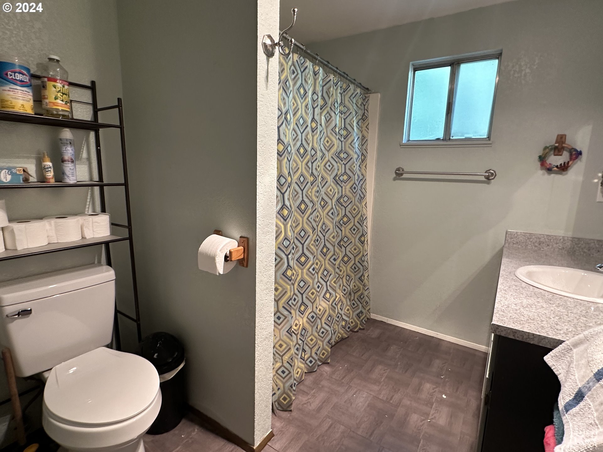 121 Copper Way Riddle, OR 97469 - Photo 12 of 21 a bathroom with a toilet and a shower