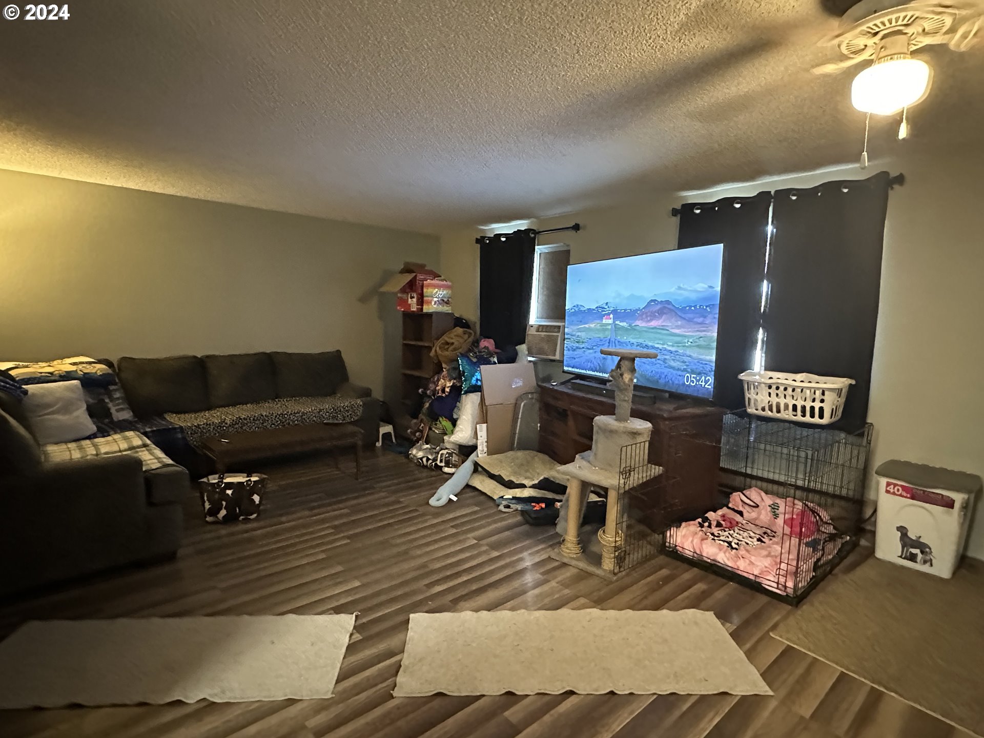 121 Copper Way Riddle, OR 97469 - Photo 6 of 21 a living room with furniture and a rug
