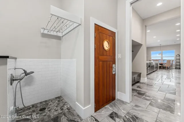 an empty room with windows and entrance