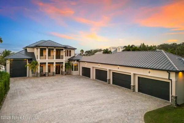 a view of a house with sitting area and swimming pool