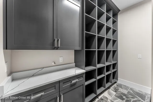 a front view of a house with a yard table and chairs