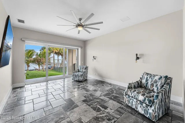 a front view of a house with a garden and plants