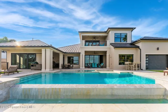 a room with pool table and windows