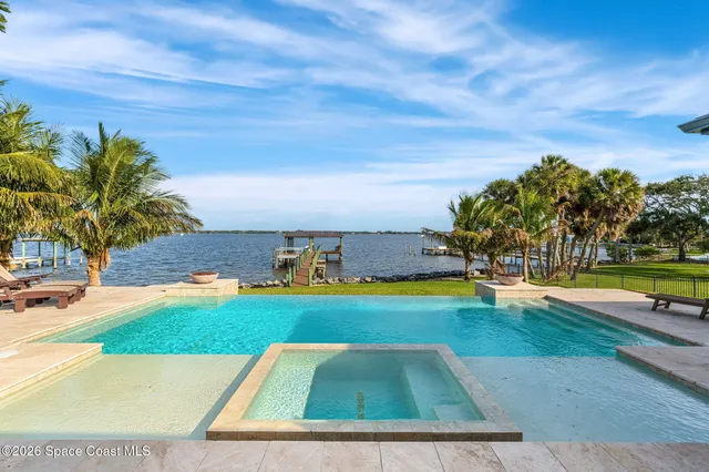 a living room with furniture and a ceiling fan