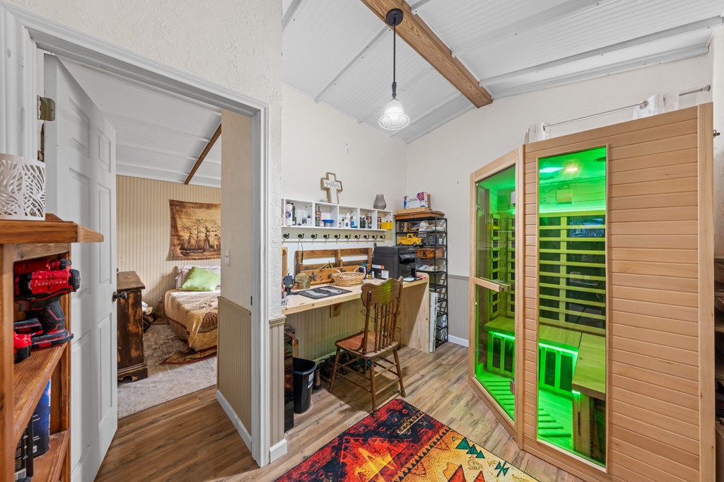 152 Henderson Branch Road West Ingram, TX 78025 - Photo 11 of 47 a view of a workspace with furniture and a window