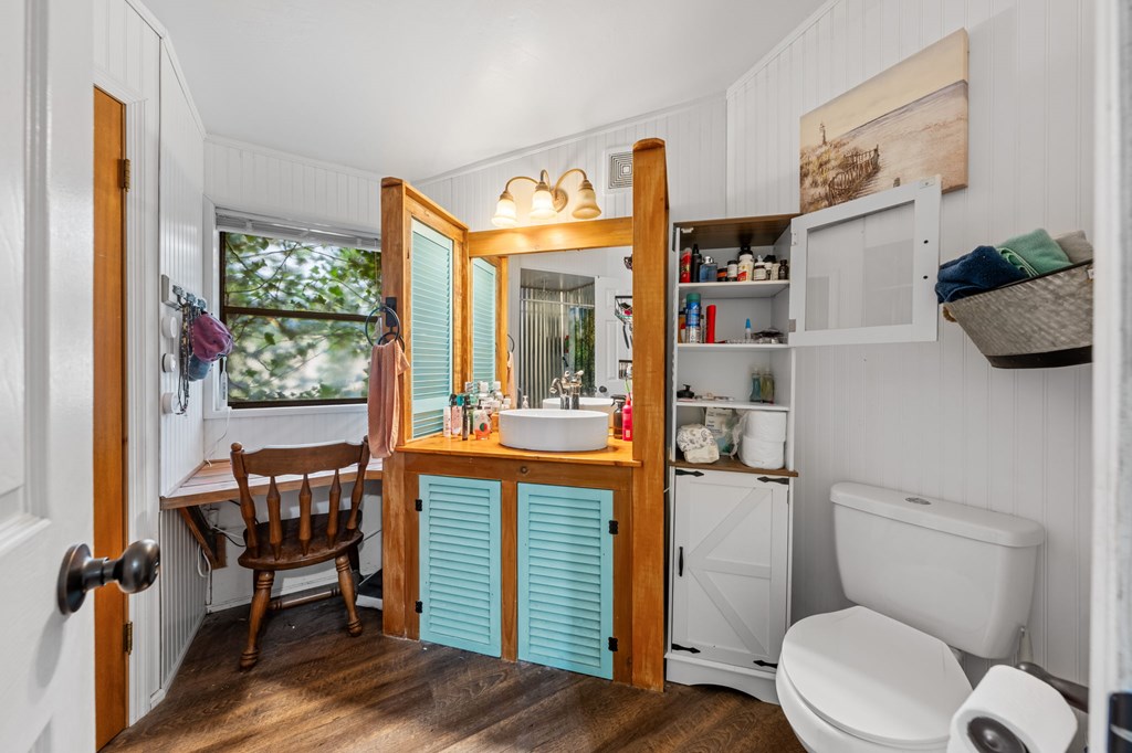 152 Henderson Branch Road West Ingram, TX 78025 - Photo 13 of 47 a bathroom with a toilet a sink and a large mirror