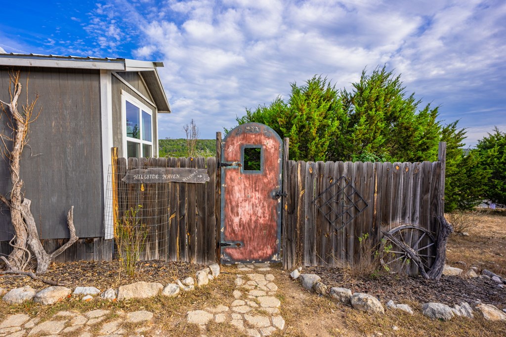 152 Henderson Branch Road West Ingram, TX 78025 - Photo 14 of 47 a backyard of house with lots of green space
