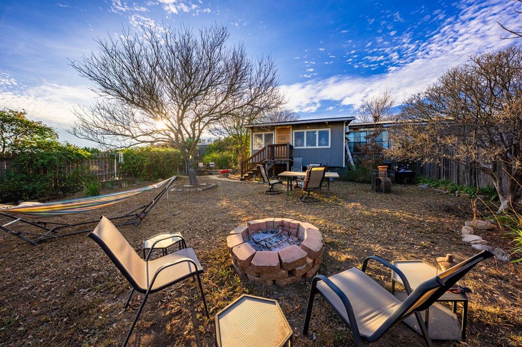 152 Henderson Branch Road West Ingram, TX 78025 - Photo 19 of 47 a backyard of a house with fire pit and outdoor seating