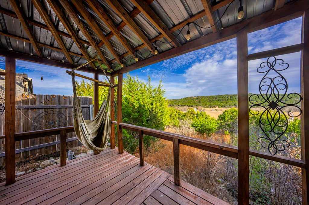 152 Henderson Branch Road West Ingram, TX 78025 - Photo 21 of 47 a view of a balcony with wooden floor