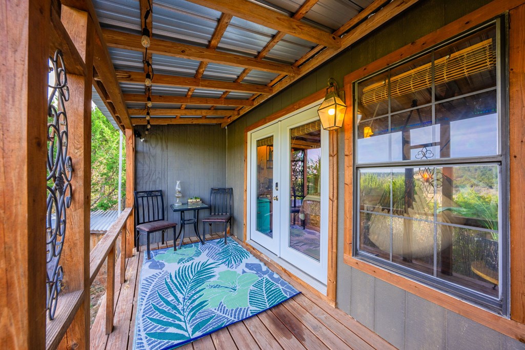 152 Henderson Branch Road West Ingram, TX 78025 - Photo 22 of 47 a view of living room with furniture and floor to ceiling window
