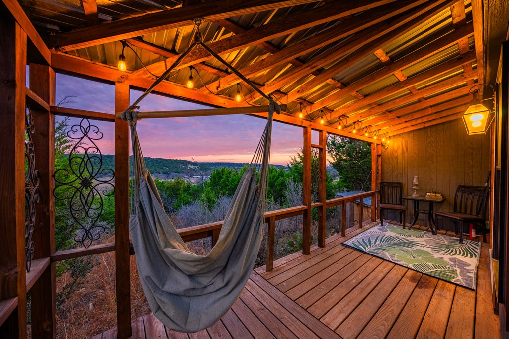 152 Henderson Branch Road West Ingram, TX 78025 - Photo 26 of 47 a view of a two chairs in the balcony