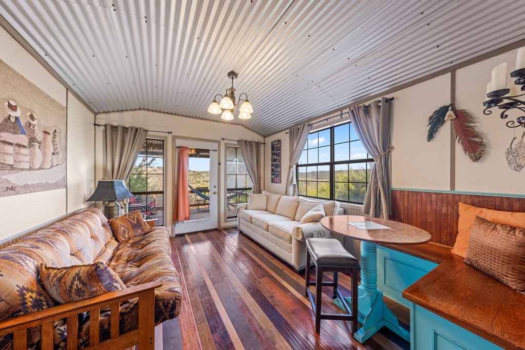 152 Henderson Branch Road West Ingram, TX 78025 - Photo 30 of 47 a living room with furniture fireplace and large windows