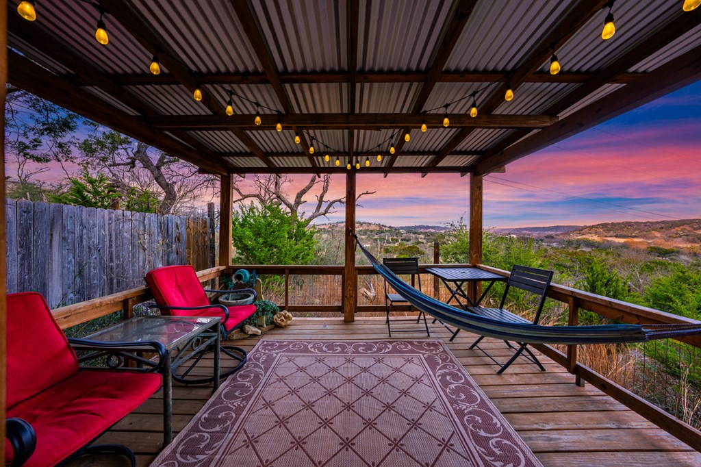 152 Henderson Branch Road West Ingram, TX 78025 - Photo 3 of 47 a sitting area with furniture on wooden deck