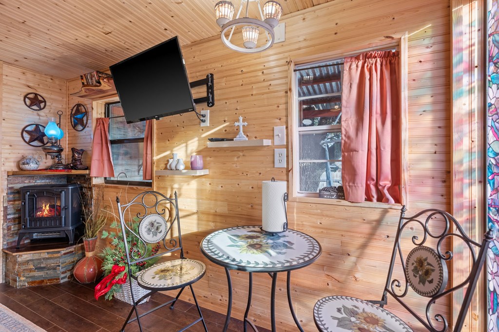 152 Henderson Branch Road West Ingram, TX 78025 - Photo 41 of 47 a view of a dining room with furniture and a fireplace