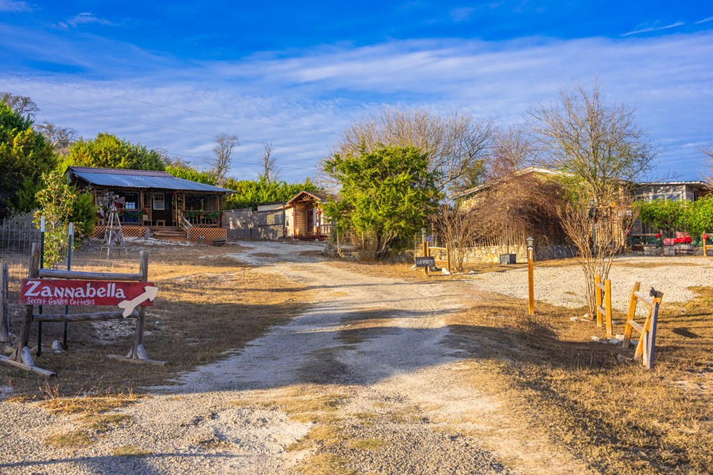 152 Henderson Branch Road West Ingram, TX 78025 - Photo 5 of 47 a view of a swimming pool with an outdoor space and seating area