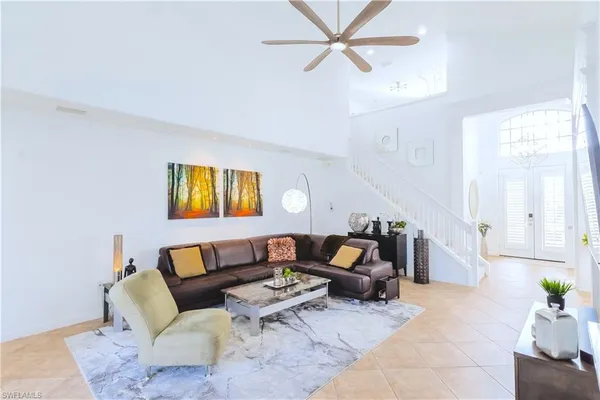 a bedroom with furniture and a chandelier