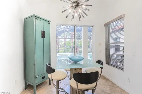 a spacious bathroom with a granite countertop sink a large mirror and a shower