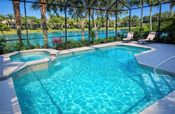 a view of a backyard with sitting area and garden
