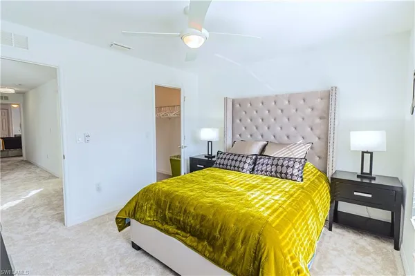 a bathroom with a sink mirror vanity and toilet