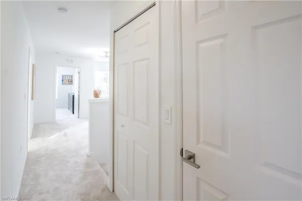 a dining room with furniture and floor to ceiling window