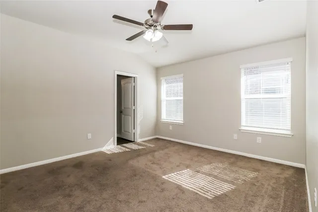 a kitchen with granite countertop a sink stove and cabinets