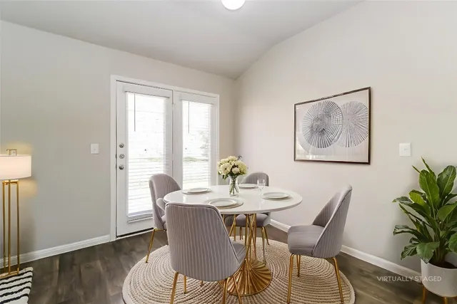 a kitchen with stainless steel appliances granite countertop a sink and a refrigerator