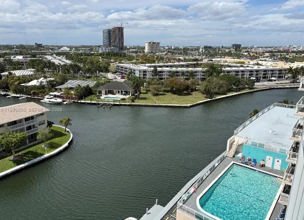 an aerial view of a house with a lake view