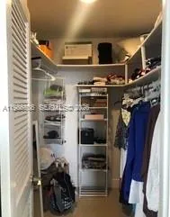 a kitchen with refrigerator and microwave