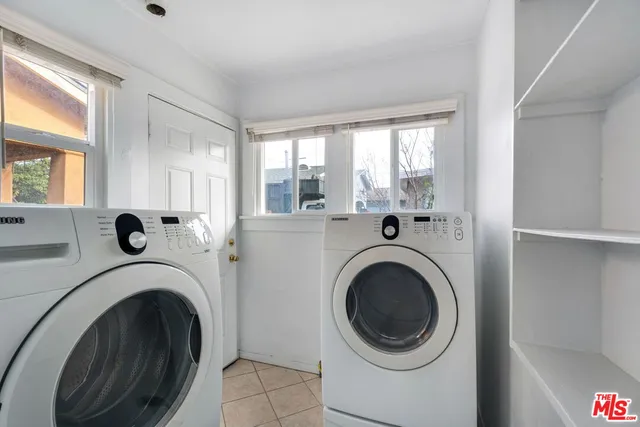 a view of a hallway with washer and dryer