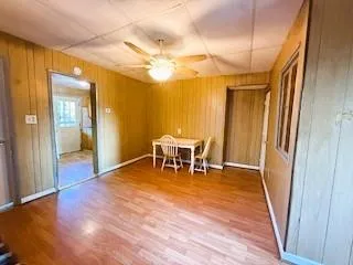 a dining room with furniture and chandelier
