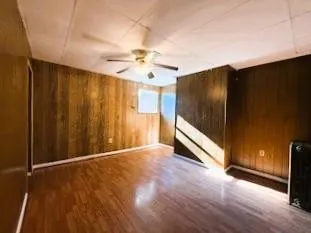 a view of a livingroom with wooden floor