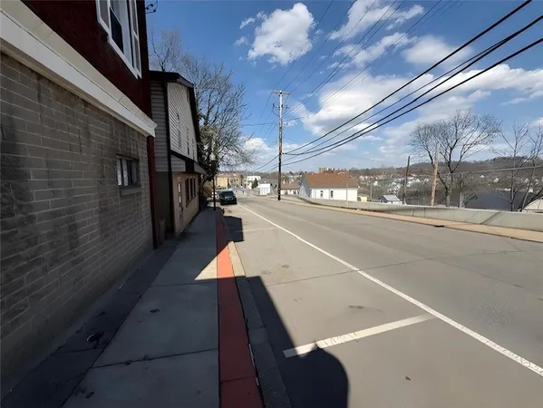a view of a street with furniture