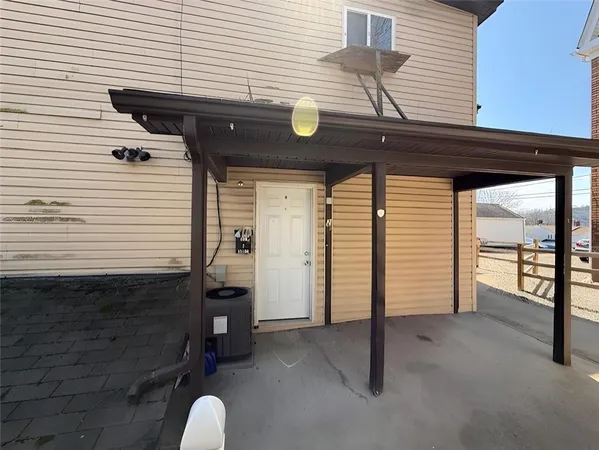 a view of a porch with furniture