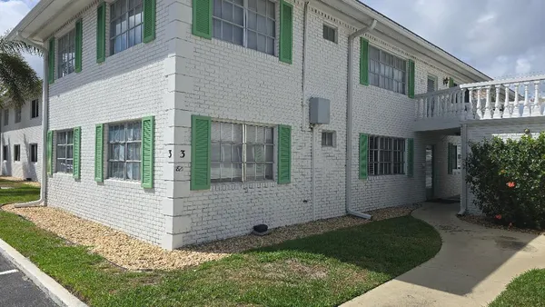 a view of house with yard