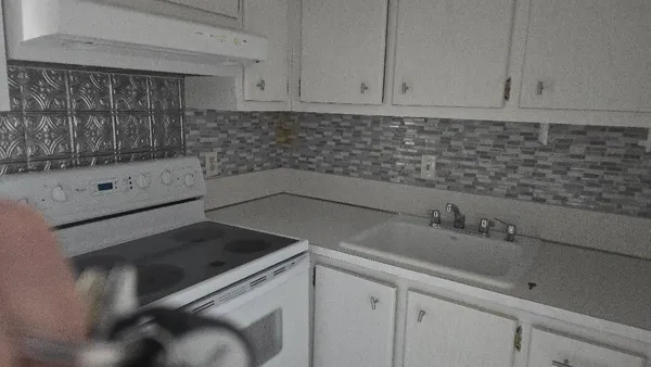 a kitchen with a sink and cabinets