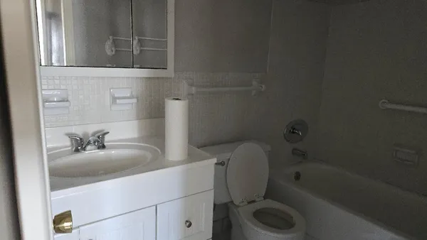 a bathroom with a toilet sink and bathtub