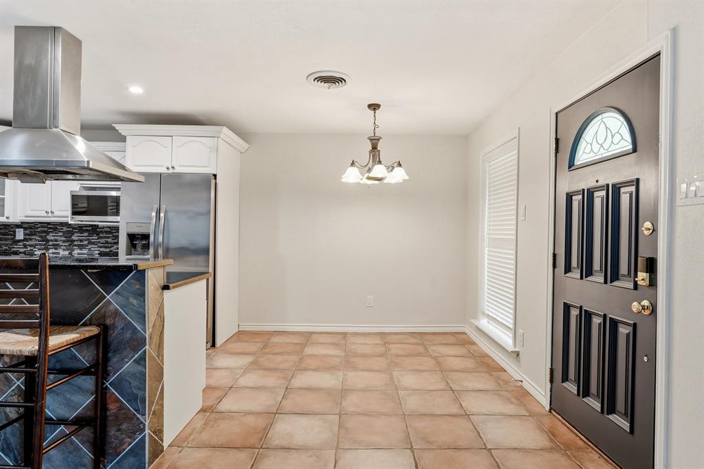 7354 Walling Lane Dallas, TX 75231 - Photo 11 of 28 a view of a kitchen with a sink cabinets and window