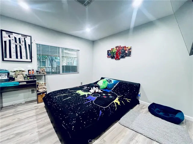 a bedroom with bed and a window